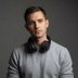 Portrait of Tomas, contributor, wearing headphones around his neck